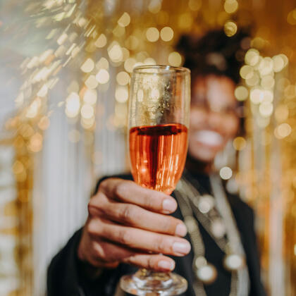 Chief Experience Architect, Audrey, smiles while wearing a t-shirt that says "Winefulness".